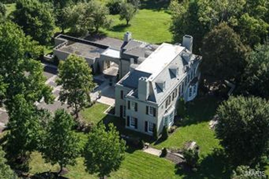 A classic French Manse which epitomizes refined and elegant lifestyle; on one of Ladue's most coveted, exclusive addresses. 4BD/5BA, w/over 7,000SF of gracious living; on 1.8 manicured acres. Designed for large scale entertaining.  Glistening marble and hardwood floors; w/expansive rooms, elaborate moldings, and custom lighting. Exceptional and modern Kitchen exceeds expectations w/double islands, integrated SubZeros & Wolf appliances. Updated Master Suite features luxurious bath w/dbl vanities, jet tub & sep. shower. 3 add'l BR's + 2nd floor laundry w/a 2nd staircase to Main. 3rd floor offers excellent rec, living, media, exercise room, or potential 5th en-suite BR. Thoughtfully updated and ideally turnkey; for those who appreciate Elegance but not interested in taking on projects or renovations. New slate roof, 2013.  Potential circle drive from the cul-de-sac. Porte-Cochere, 3-car garage and extravagant parking court. Minutes to all Private and Public Schools & finest restaurants.