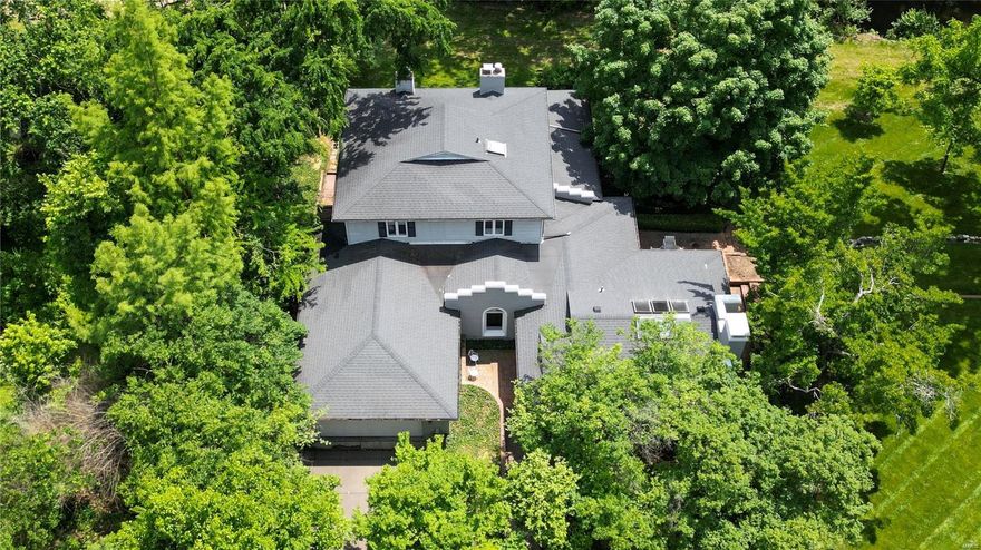 Discover this stunning 3,700+ square foot home, where coastal charm meets contemporary elegance in Ladue. The .74 acre lot is completely private. Enter to a soaring vaulted wood ceiling with skylights and a wall of windows, filling the space with natural light. The living room, featuring a cozy wood-burning fireplace, opens to a brick terrace. Charming breakfast/card table nook. The dining room, featuring a wet bar and vaulted ceiling, also opens onto the brick terrace, creating an effortless flow for entertaining. Office off of the living room. The main floor primary suite boasts a fireplace, 2 walk-in closets and a sitting room with floor-to-ceiling windows. The primary bath includes a shower, soaking tub & dual vanities. Sunroom with marble floors and a built-in hot tub just off the primary bath. The kitchen has ample cabinetry, pantry and an adjoining family room with a fireplace. Upstairs find 2+ additional bedrooms, each with en-suite bathrooms. 2-car garage. Main floor laundry.