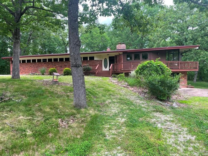 Don't Miss out! This sprawling ranch style home situated on 5.2 acres of land is located in a quiet and secluded tree-lined setting but just a few minutes outside of town. Featuring fireplaces on each level of the home and floor to ceiling windows in the basement for plenty of sunlight.  All three bedrooms including the owner suite are located on the main level with a family room and half bath in the basement. All of this plus a HUGE detached garage/workshop. Call today for additional information or to schedule a showing. SpecialListingConditions: Foreclosure