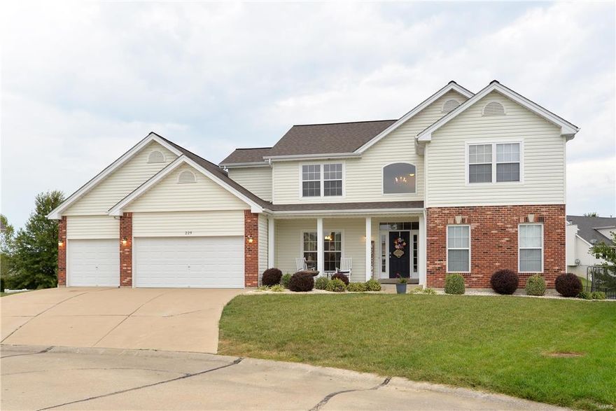 Cul-de-sac, 3 car garage, main floor master suite, 9 foot ceilings and much more! Spacious home with great curb appeal.  Inground pool, still plenty of yard for fun, covered patio and deck.  Wood floors throughout most of the main level.  Open floor plan.  Dining room with designer ceiling.  The great room features call of display shelves and a 2-sided fireplace shared with the breakfast room.  Vaulted kitchen has 42” cabinets, title back-splash, large breakfast bar, hard surface counters tops, pantry, butler’s pantry and stainless-steel appliances.  Main floor master suite.  Plush master bath with his & her sinks, soaking tub and separate shower.  Main floor laundry with tub.  Upstairs you’ll find a bonus room, 2nd laundry room and spacious bedrooms.  Walk-out lower level with family room/theater room, rec room, sleeping area, full bath and plenty of storage.  Lots of living space and a great place to call home.