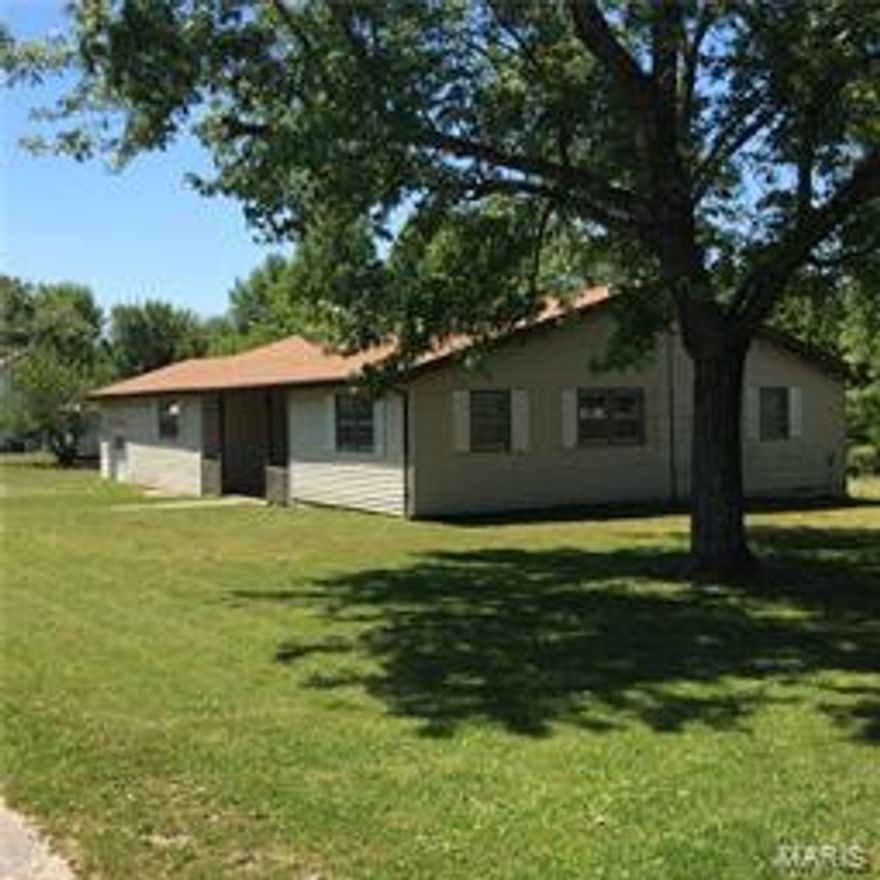 This home features over 2000 SF of living space and sits on almost a half acre lot.  This spacious home has a back yard with a country feel while being inside the city limits.  A covered back porch leads to a flat large lot that is great for entertaining.  The large kitchen opens into the dining area and has plenty of room for that large kitchen table for family meals.   Plenty of room in the living room for a large family to enjoy movie time!  The roof was new in 2009 and the home has central air and natural gas heat.  This is a lot of home for the money!  Do not miss out on this home.  Take look today!