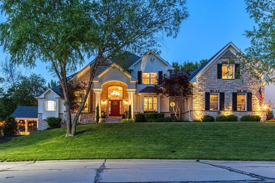 Soaring ceilings, extensive millwork & Asian walnut flooring add to the appeal of this spectacular brick & stone 1.5 Sty. Impressive 2-Sty slate foyer opens to private study with 11’ ceiling & French doors, sophisticated dining room & vaulted great room with brick & stone fireplace flanked by built-in bookcases. Designer kitchen featuring glazed white cabinetry, granite countertops & stainless steel appliances adjoins light-filled breakfast room & hearth room with floor-to-ceiling fireplace & wide bay window. Master bedroom suite with His & Hers walk-in closets & luxury bath with jetted tub offers a relaxing retreat. Front & rear staircases access 4 additional bedrooms, bonus room & 2 full baths. Walk-out Lower Level includes recreation room with entertainment center & wet bar, game room, hobby room & full bath. Situated on a .5 acre cul-de-sac lot with resort style pool with waterfall wall surrounded by landscaped gardens plus deck & patio with firepit. Katy Trail is just steps away.