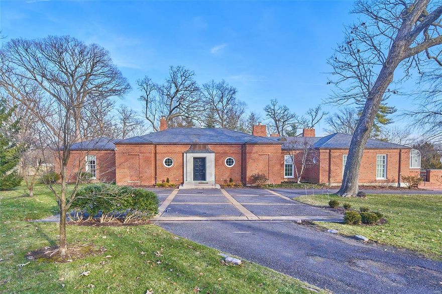 This exquisite home on a private drive in Ladue is truly remarkable. Gleaming hardwood floors, French doors, built-in bookcases, wainscoting, crown molding, fireplaces & an endless pool are just a few of the details that set this home apart. The entry hall leads you to the formal living & dining rooms, perfect for holiday gatherings and elegant entertaining. The high end, eat in, kitchen will appeal to the most discerning chef with abundant custom cabinetry, granite counter tops, Sub Zero refrigerator, Viking cooktop and Dacor oven, not to mention a butler's pantry, wetbar, hearthroom & just outside, a greenhouse to assure fresh produce & bountiful blooms. Two powder rooms, office & laundry complete this area. Two suites of 2 bedrooms each, in separate wings, both feature private sitting rooms & each bedroom offers a full ensuite bath & walk-in closet. The courtyard and lush lawn are the perfect place to relax or entertain & tasteful landscaping create a warm & welcoming entryway.