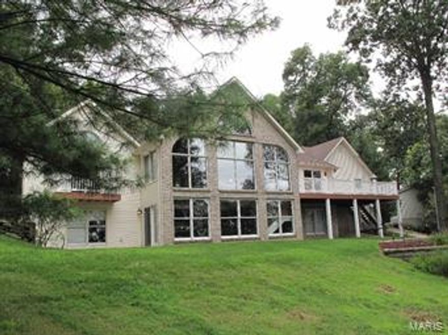 Absolutely Stunning Atrium Custom Built Ranch On 2 Acres. Privacy & Seclusion with all the luxuries! Breathtaking View and updated through out. Prior to entering check out the new 3 car detached oversized heated and cooled insulated garage (with electric) All new driveway and tons of custom block landscaping to give it that meticulous look! Enter through to all new kitchen with granite counter tops and stainless steel appliances with ceramic tile. Huge main floor laundry and formal dining room with new hardwood floors. Split bedroom plan with Luxurious master suite with walk in closet, with electric remote  fireplace and walk out to private deck!  Whirlpool tub and separate shower with overhead heater. Fabulous two story open great room with fireplace and bar. The absolute most unique gorgeous home won't last long!