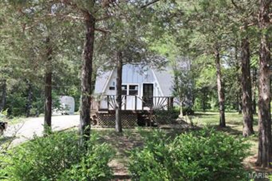 Great opportunity!  Nice home in sought after Terre Du Lac lake and golf course community!  Nice 3 bedroom home is waiting for you!   Big living room with wood flooring; French doors to the rear deck, open kitchen.  Main floor bedroom plus two more bedrooms upstairs.  Big, level, wooded lot for lots of room for outdoor fun.  All this and more in an established lake and golf community.  Enjoy fishing, swimming, boating and much more.  Home would be ideal for year round living or a weekend getaway.  See it today! SpecialListingConditions: Foreclosure
