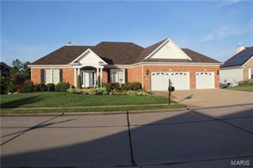 This stunning 4 bedroom, 3.5 bath atrium home is furnished with top of the line amenities & sits on a corner lot with approximately 3600 SF of living area. This beautiful home is furnished with a coffered ceiling in the master bedroom, a whirlpool bath with eight jets in the master bath as well as cultured marble shower complete with seat. There is also home a security system, hardwood floors, a unique reverse vaulted ceiling in the great room. The spacious kitchen has upgraded 42” tall raised panel hidden hinged cabinets,custom granite countertops, travertine backsplash w/ custom architecture design over cooktop, raised snack bar, upgraded faucet, additional pendant lighting, desk & large breakfast rm. Other features are 9 ft ceiling in upper level, 3 piece crown molding & custom mill work with 6 panel doors, upgraded fireplace with black granite in great room and a stone (K.C. style) fireplace in the finished LL atrium family room both with gas lines, logs & glass doors. Additional Rooms: Mud Room