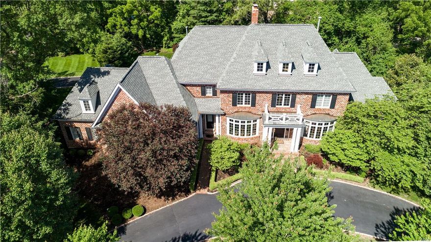 NEW Price! Classic stately 1.5 sty Georgian Colonial in the heart of Frontenac, Ladue Schools (Conway Elementary). Fabulous flr plan & move in ready! Spacious 2 sty entry w/graceful curved staircase, formal dining rm, library/study, elegant living rm w/a wall of windows, extensive hardwood flooring, multi-piece mill-work, Gourmet kitchen w/center island, 2 sinks, Wolf 6 burner gas range, Subzero, opens to Breakfast rm & Hearth rm w floor to ceiling stone fireplace. Main flr laundry & mud rm. 2 main flr powder rms. 1st flr Master Suite w/coffered ceiling & bath: w/Kohler jet tub, over sized shower, make-up vanity, dressing area & large walk in closet, dr to deck. 4 bedrooms upstairs, custom bead & beam ceilings, media rm w/theater & surround sound & 2nd flr laundry.  Front & back staircase, deep pour foundation,  exercise rm in LL, 3 car garage, circle driveway, sprinkler system & brick patio. Within walking distance to schools, country club, & within a mile of two major hospitals. Additional Rooms: Mud Room