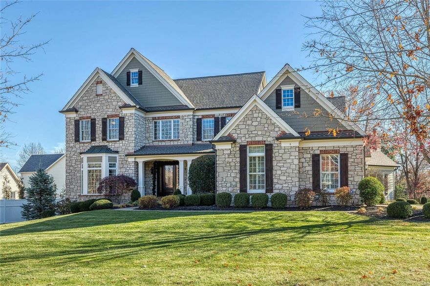 Spectacular stone-crafted 1.5 Sty in premier location! Impressive marble foyer leads to private study with French doors, elegant dining room and stunning great room with 12’ box beam ceiling, marble fireplace & bank of windows. Designer kitchen featuring granite countertops, glazed cherry cabinetry, butterfly center island & butler’s pantry adjoins light-filled breakfast room & hearth room with beamed cathedral ceiling & stone fireplace. Spacious master bedroom suite offers an appealing retreat with wide
bay window & beautifully appointed bath with jetted tub. Front & rear staircases access 3 additional bedrooms, 1 with ensuite bath & 2 with Jack n’ Jill bath, & bonus room with 3rd fireplace. Lower Level entertainment space includes recreation room with wet bar, game room, workout room, wine cellar & full bath. French doors open to outdoor living area with resort style pool surrounded by landscaped gardens plus stamped concrete patio w/pergola, grilling station & full-height fireplace Additional Rooms: Wine Cellar