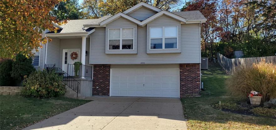 Awesome looking Tri-Level in St Johns Crossing.  Enter into the main level with entry foyer and living room featuring full masonary woodburning fireplace with brick hearth.  Extremely cozy for watching your favorite program, or just relaxing reading a nice book.  Walk up to upperlevel which feature a formal dining room, which overlooks the living room, large eatin kitchen with custom cabintrey, pantry, full array of appliances, which all stay, and plenty of counter-top space for cooking.  Walk-out from kitchen to a nice re-built deck overlooking a private backyard setting.  Back inside from kitchen, go down the hall to the 3 bedrooms and hallway bath.  The large Master Bedroom has a walkin closet and full master bath, shower only.  The lower level has a little setting area outside the laundry room which has a large storage room.  Other Tri-levels have converted this space into another bed and bath.  The attached 2 car oversized garage has a nice work bench and area for the handy man.