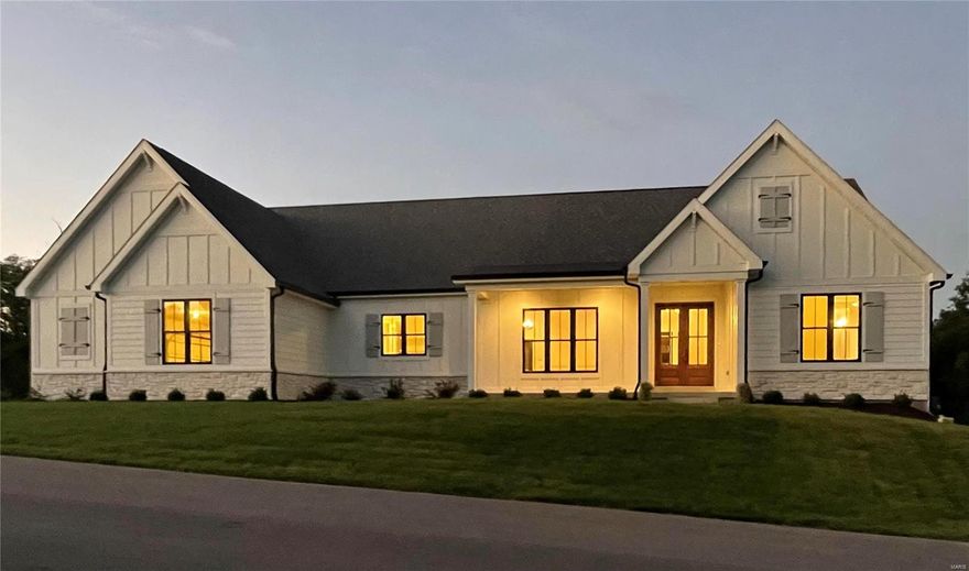 Welcome home to the elegant NEW custom crafted Farmhouse in Homestead.  This timeless classic home sits on 1.19 acres overlooking harmonizing natural woods & wildlife.  Opulent features include oversized 4-car garage, James Hardie siding, country front porch, & grand Mahogany front doors. Amazing Great rm w/ soaring cathedral beam ceiling & fireplace. Exquisite black designer windows, transoms & doors. Flawless quality kitchen, pantry, stacked shaker cabinets w/ lights, Wolf range, Bosch DW, drawer micro, Kohler cast iron white farmhouse sink, bev center, Quartz countertops & huge center island where culinary perfection & family flourish!  Primary Bedroom Suite w/ charming cathedral beam ceiling, walk-in closets, soaking tub, & porcelain tile shower w/ 2 shower heads.  Main floor offers 2 additional bedrooms w/ en-suites.  Laundry room w/ closet & built-in cubbies.  The walk-out finished lower level features French doors, rec/game room, fireplace, wet bar, 4th bedroom & bath!