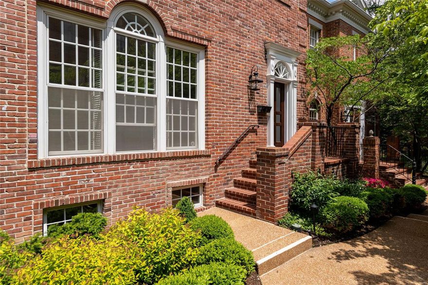 You will fall in love with this stylish all-brick Georgian townhome that served as the display when this enclave was built. Over 4,000 sq feet of living space with special design features: solid mahogany doors, 10’ ceilings on the main level and gorgeous crown molding, millwork & hardwood floors throughout. Ample windows flood the home with natural light. The living room is inviting with a gas fireplace & built-in bookshelves & opens to the expansive dining room. Mahogany paneled den with marble fireplace surround. The eat-in kitchen features maple cabinets, generous storage & French doors leading to the deck. Lovely primary bedroom with a fireplace, 2 walk-in closets & luxurious bathroom with 2 vanities, jacuzzi tub & shower. The 2nd floor also has a laundry, 2 more bedrooms & another full bath. The finished lower level has a bedroom, full bath & office. The outdoor space is lovely with an expansive deck off the back & the front courtyard with beautiful landscaping. 2-car garage. Location: End Unit
