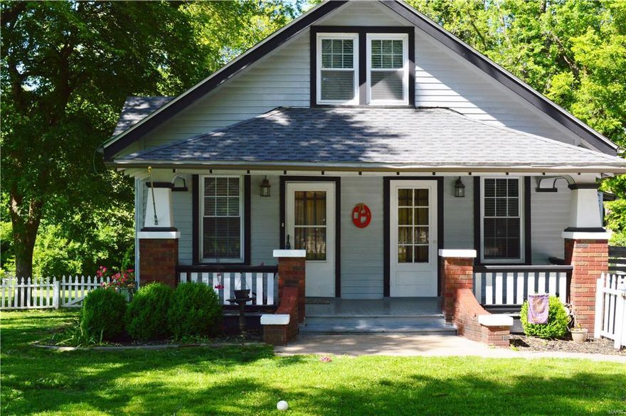 Welcome to 4405 Robbins Mill Road! This one is a classic 1930's charmer, down to the long, COVERED FRONT PORCH and the WHITE PICKET FENCE! Main Floor Master AND Main Floor Laundry. 3BR/1.5 BA/2 Car Detached Garage, Utility Shed, 1.5 Story Home with OVER AN ACRE OF GROUND! The home's warm hardwood flooring throughout the main level and original wood panel doors (w/glass knobs!) are sure to please. Main floor bath features original built-in medicine cabinet, linen closet & updated vanity. Beautiful kitchen w/granite counters, glass tile backsplash, 2 pantries, glass-front cabinets w/plate rack at breakfast bar, & newer appliances. Mud Room/Main Floor Laundry walks out to deck. Spacious secondary bedrooms are upstairs, along with a half bath. Walk-up/Walk-out full basement. System updates include: New Roof 2012, A/C 2012, Furnace 2009, & Water Heater 2009. Peaceful nature setting is like living in the country with easy access to nearby conveniences. You'll be proud to call this one home! Additional Rooms: Mud Room