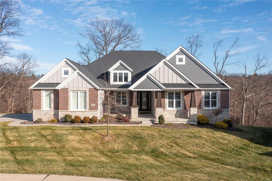 Overlooking the bluffs in prestigious Windcastle, this custom smart home built in Dec 2017 sits on over 2.5 acres offering panoramic views over the Missouri River. 10' ceilings, extensive millwork, transom windows, custom plantation shutters & archways can be found throughout this open floor plan. You will immediately notice the impeccable stone archway over the gas range in the gourmet kitchen, along w/deluxe custom cabinetry, double islands & granite counters. The kitchen opens to the beautifully appointed great room w/stone fireplace & leads to the covered, composite deck leading down to the expansive, aggregate patio. Luxurious primary suite boasts dual walk-in closets & vanities, heated floors & oversized walk-in shower w/marble base. 2 guest bedrooms, add'l full & half baths, private office w/french doors & mudroom w/built-ins complete the main floor! Built for entertaining, the lower level hosts an exquisite wet bar, custom wine room, theater room, full bath & 4th bedroom. Additional Rooms: Mud Room, Wine Cellar