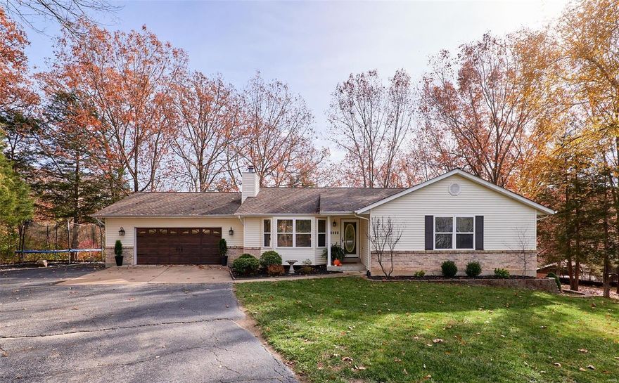 Welcome to this beautifully updated 3 BR/2 BA ranch located on a quiet and private lot! You will fall in love with this home as soon as you pull up to the property! Nestled back, surrounded by trees it is truly a peaceful and serene setting. This home boasts vaulted ceilings in the living room as well as the kitchen, stunning hardwood floors throughout, wood burning fireplace and bay window in living room, spacious luxury master bath with double sinks, his & hers walk-in closets, stylish open stairwell with wood railing that leads to a full basement which is framed out waiting for your finishing touches, also including a bathroom rough-in. French doors off the kitchen lead out to a large deck overlooking the spacious back yard and woods. Newer roof and HVAC. What a great home, don't miss this one!