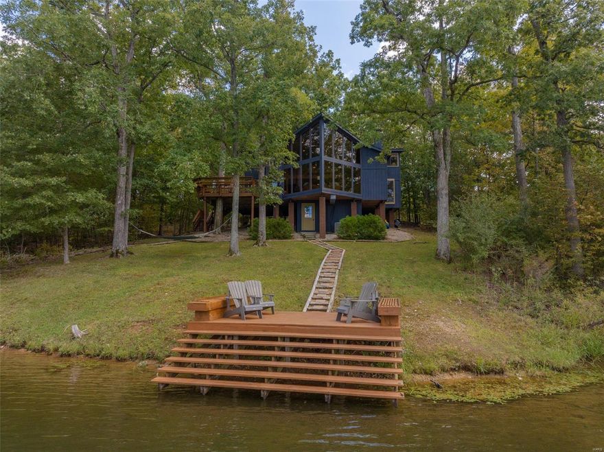 You'll love this stunning chalet perched on the shores of Lake Linden at Innsbrook Resort. The massive great room wall of windows provide breathtaking views of the lake. Soaring ceilings, rustic tongue and groove cedar, and the floor to ceiling stone fireplace make this quite the grand entertainment space. Cook away in the huge kitchen. Enjoy a board game with the kids in the dining nook. Every bedroom is oversized allowing plenty of guest space sleeping. The bunk room alone sleeps 10! A wall could easily be built in the massive loft creating a 4th bedroom if desired. Grill with friends on the large deck. Then wander down to the lake where clear water greets you. Cast a line or launch a paddle board. On the community sewer and rentable. Freshly painted exterior and stained decks. Fully furnished and ready for weekend fun! This unbelievable property won't disappoint. Start making family memories at 2421 Alpine Lake Dr!!