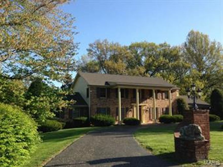 Wonderful opportunity to renovate this gracious Frontenac home into a showplace! The floor plan is flexible with large second floor  Master-Suite with nice bath and large closets, and well as a second large suite on the first floor. All the rooms are bright and spacious with hardwood floors throughout most of the home. The family room has nice bookshelves, lovely fireplace, bay window, wet bar and French doors to patio.  There is  also an opening to the living room from the family room .  The lower level has lots of possibilities with over 1600 square feet of finished space divided into three areas and walks out to gorgeous one acre lot!  
 Make this home your own and live on a lovely tranquil lane in Frontenac!