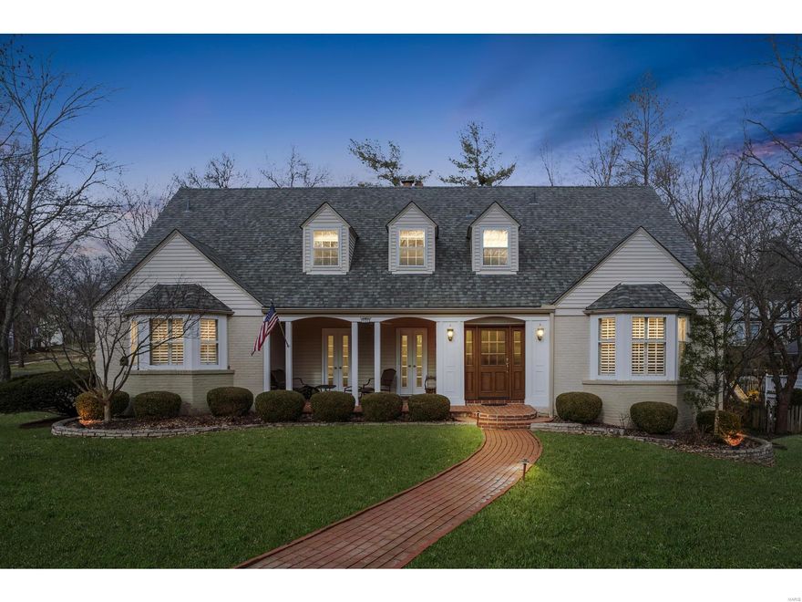 NEW PRICE!! One look at the charming home, with its gracious covered porch, confirms that this is a remarkable opportunity in one of Ladue's favorite neighborhoods! The updated 5 bedroom, 4.5 bathroom home is beautifully appointed and move-in ready. The living and dining rooms boast lovely millwork, arched doorways and gleaming hardwood floors. The open-style family room features built-ins  and gas fireplace, with breakfast room and gourmet kitchen beyond. Flexible floorplan includes main level bedroom and a second bedroom that can make an ideal office. The spacious second floor master suite, with its hearth sitting area, is an inviting retreat with an enviable walk-in closet. Two other ensuite bedrooms are large and bright, and a bonus room serves as bedroom, office or playroom. The lower level includes finished rec room with loads of storage space. A main level laundry, picture perfect patio and 2-car garage complete this listing in the Ladue School District.