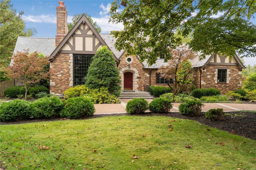 This bespoke light filled tudor offers all the modern conveniences while preserving its old-world charm from the slate roof to the meticulous terrazzo flooring.  Large updated windows throughout drench every room in light.  Entertaining and quiet time are both seamless with the sun drenched great rm, den, custom kitchen and dining rm.  A serene main floor primary suite with true custom organized closets and private luxury bath along with a well-appointed powder rm complete the main floor.  Find a bedrm suite and 2 bedrms with jack/jill bath on the 2nd flr.  The lower level is a knockout with wood flooring, fam rm, rec rm with true walk behind wet bar, private office, workout rm and half bath.  The perfect opportunity for all to spread out and enjoy.   A lovely patio further extends your entertaining possibilities.  Many many updates and the walkability to Ladue shops, restaurants and schools make this the perfect property.
