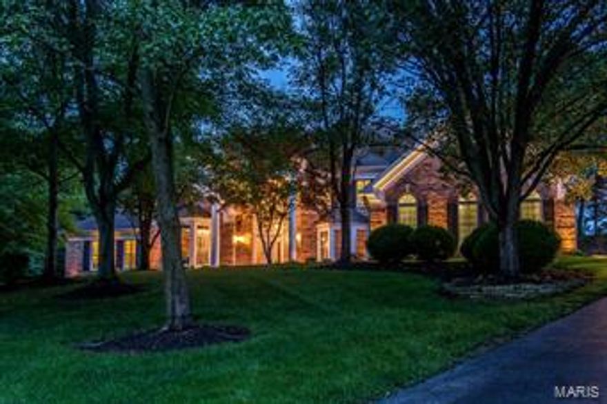 Spectacular DeShetler-built 1.5 Sty w/7612 sq ft of total living space in premier neighborhood! Grand 2-sty hardwood foyer highlighted by dramatic sweeping staircase leads to handsome paneled library w/sculpted ceiling & built-in bookcases, elegant dining room w/ beautiful millwork & bay window & stunning great room w/2-sty wall of windows, brick fireplace & atrium door to patio. Spacious open kitchen w/42” cabinetry, premium appliances, center island w/breakfast bar & wet bar adjoins breakfast room  w/convenient planning center & vaulted hearth room w/full-height brick fireplace. Coffered master bedroom suite w/huge walk-in closet & luxury bath w/Jacuzzi. The 2nd floor extends the living quarters w/4 additional bedrooms, 2 w/private baths & 2 w/Jack n’ Jill bath. Incredible walk-out Lower Level w/recreation room w/marble fireplace & wet bar, family room, game room, media room & full bath. Tree-lined 1.3 ac grounds include patio w/grill center, pool, hot tub & 4-car garage.