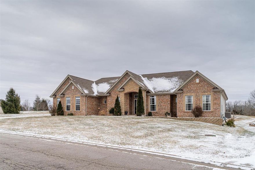 Exceptional, quality-built home awaits the fortunate buyer. As you enter the great room w/contemporary gas fireplace & hardwood flooring, the showcase wall of windows offers a wonderful view of the large backyard. The kitchen is a chef's delight w/gas stove, granite counters & 42" cabinets, while the breakfast bar offers cozy seating or use the eating area for family meals, situated in a bright bay window. Unwind at the end of the day in the spacious master retreat, w/sitting area & master bath, featuring a jet tub, tiled shower & 2 separate vanities Three other comfortable bedrooms offer walk-in closets, too. Entertain or relax w/your family in the finished basement w/bar, full bath & BR #4.  A nice den/office, main floor laundry, 3 car garage, covered patio plus a huge storage area, completes this beautiful home. Located in Ming Estates, w/community lake, it's minutes from I-44, for an easy commute to the city or head to Washington for great restaurants & shopping. Call this HOME!