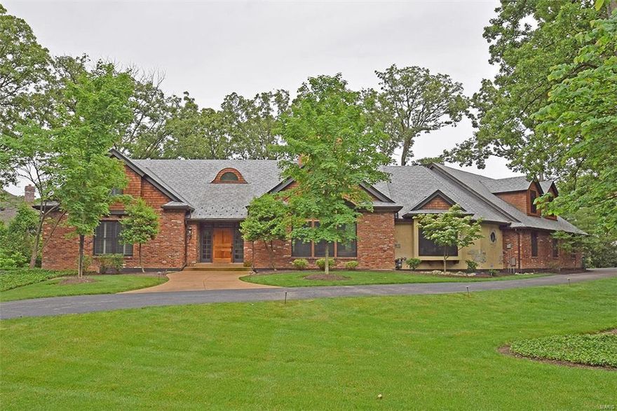 A rare find: Colorado Luxury in TOWN & COUNTRY & Ladue Schools. More features than can be mentioned: 25' cathedral ceiling of Awesome Timber Beams and floor to ceiling Stacked River Stone double-sided Fplc. This light-filled home was recently rebuilt and finished with the highest quality finish, fixtures, & systems. Expansive main floor includes GOURMET KITCHEN with top-shelf appliances, Granite and Subway Tile, true custom cabinets-lighted and with glass fronts, a breakfast room with vaulted ceiling, and access to the huge deck spanning the entire back side. Also on the main is a tremendous BOX BEAMED Ceiling'd DR, garage entry to cubby room, laundry room, and WI pantry and a Master suite of pure luxury: marble, granite and tile set off the ultimate steam shower and custom cabinetry. Second level is actually 2 separate wings, each with 2 bedrooms luxury baths, and walk in closets. And the lower level adds fantastic living space. All this one 1 acre with easy access to everywhere! Additional Rooms: Mud Room