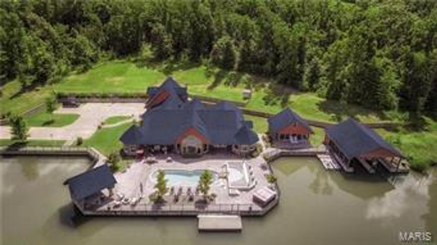 PRIVATE LAKE ESTATE! Nestled in a quiet valley in Southeast Missouri lies a 222 acre paradise with a 5000 square foot residence overlooking an expansive spring fed lake. Log exterior with stone accents set the tone for a rustic atmosphere, while this 4 bedroom, 6 bath home features all the modern amenities an estate of this caliber should, including a gourmet kitchen, luxurious master suite and a personal exercise facility. Amenities lake side include a 39' pool with fiber optic lighting, tanning ledge, hot tub & cabana featuring a expansive outdoor kitchen.  This property was built with entertaining in mind. Guest accommodations include 3 camper pads with utilities, 3000 sq. ft. pavilion, large dock area, 2 covered boat slips, concrete boat ramp and master boat house with 2 additional covered boat slips, full bath & changing facility. With the ability to host nearly any outdoor activity from hunting to waterskiing, this is truly a must see recreational paradise!