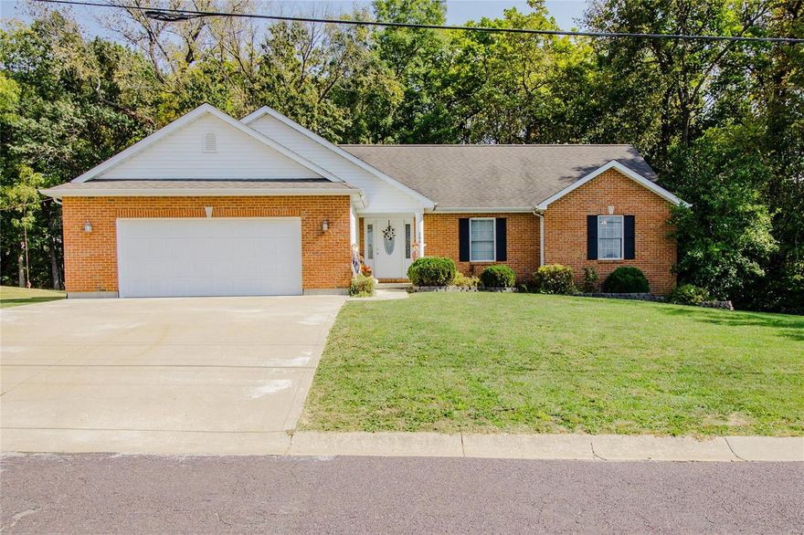 This brick front 4-bedroom, 3-bath ranch home with 2-car garage has over 2,700sqft of living space! The spacious foyer with hardwood floors welcomes you into the vaulted great room with gas fireplace. The open floorplan flows into the kitchen/dining combo featuring white cabinetry with crown molding, stone backsplash & breakfast bar. Appliances stay! A coffee bar in the dining area is the ideal prep space to brew your morning cup to enjoy on the vaulted screened deck that overlooks the tree-lined backyard with firepit. The owner's suite is large enough for your matching bedroom set & has a private full bath & walk-in closet. Two guest bedrooms, full bathroom, & laundry room with deep sink, closet & folding counter are also on the main floor. The finished walk-up basement has a rec room wired for surround sound & a stone wetbar. The separate game room could be used as a den or playroom. A 4th bedroom, full bathroom & storage with built-in shelving are also downstairs. See it TODAY!