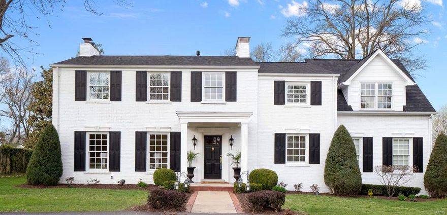 This home is the definition of classic and timeless in cherished Ladue. Entire interior is freshly painted and crafted to perfection. The 2 story entry foyer welcomes you into a bright LR with ample natural light and a stunning FP. Custom built-ins and rich hardwood floors flank the entire home. Elegant DR flows into a spacious FR with additional FP and walk-out to private patio. Wonderfully updated kitchen equipped with stainless steel appliances, granite counter tops, custom cabinetry and 2 wine coolers. Handsome private office off the back hall.  Upper level includes an Owner's Suite wing with amazing natural light and large walk-in closet. Private bath features double vanities, whirlpool tub and beautiful walk-in shower. Three additional BR's and 2 full baths on upper level with expansive closet space. Large 2nd floor laundry. Huge backyard and patio is perfect for entertaining your favorite people and room for a pool. It's move in ready and you'll love calling it home.