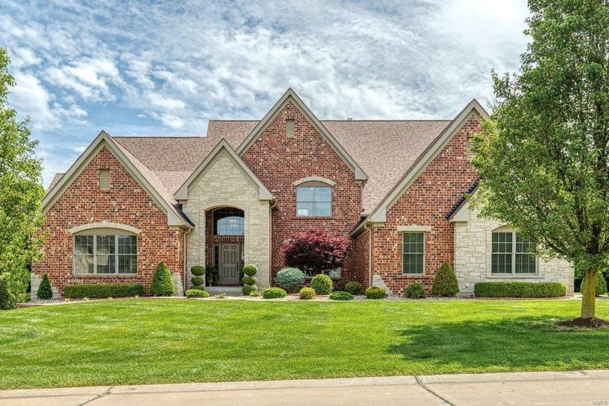 Spectacular full brick & stone 1.5 Sty from award-winning builder Schaeffer Homes. Impressive hardwood foyer with 14’ ceiling opens to private study, sophisticated dining room with wide arched entryway & architectural columns & stunning great room with marble fireplace flanked by built-in bookcases, wet bar & dramatic wall of windows. Designer kitchen with bisque cabinetry, granite countertops, premium appliances, convenient planning center & butler’s pantry adjoins breakfast room with bay window & hearth room highlighted by floor-to-ceiling stone fireplace. Spacious master bedroom suite with His & Hers walk-in closets & luxury bath offers an appealing retreat. The 2nd floor extends the living quarters with 3 additional bedrooms, 1 with ensuite bath & 2 with Jack n’ Jill bath. Lower Level entertainment space includes recreation room with fireplace & bookcases, billiards room, gathering bar & full bath. Situated on a .79-acre cul-de-sac lot with patio, landscaped gardens & 3-car garage.