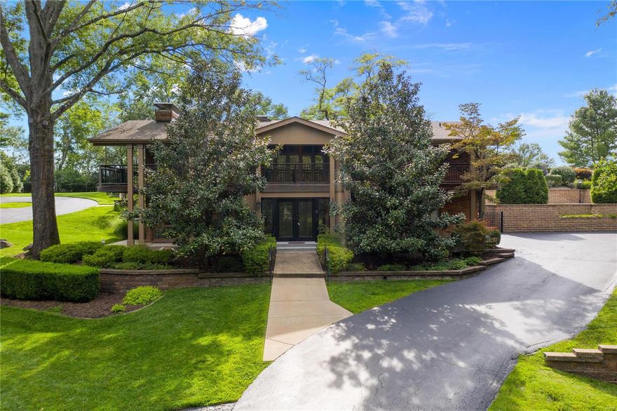 Custom designed home, offers amazing views of the impressive, 1.4 acre private grounds. Dramatic 2 story entry with open staircase, vaulted ceilings throughout, stunning wood floors, 3 fireplaces, and sought-after open floor plan w/walls of windows provide an overall feeling of spaciousness. Gorgeous kitchen features substantial center island, luxury appliances, granite, & incredible cabinet space - fabulous for entertaining! Luxurious main floor master suite overlooking pool terrace. Three additional bedrooms all have en-suite baths & the 5th bedroom makes a great office w/ FP & private entrance. The home also offers a media room w/entertaining area, elevator, & generator! Outdoor features include heated salt water pool w/spacious terrace, veranda encircling much of the home, climate controlled greenhouse room, additional circular drive with entry to main level, waterfall, organic garden & extensive landscaping. Truly a special property! VIRTUAL 3-D TOUR also available upon request.