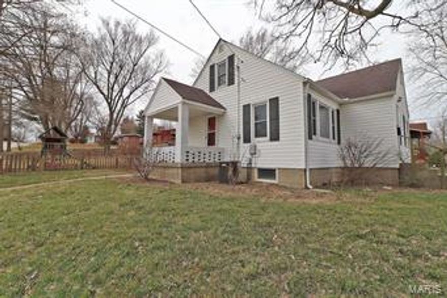 Adorable 4 bedroom, 1 bath home on a corner lot! The owners have taken great care in updating almost every room! The recently remodeled kitchen has new countertops, new flooring, freshly painted cabinets and stainless steel appliances. The connected dining room has enough room for a full dining set. There are two bedrooms on the main level with plenty of closet space. The upstairs has two additional bedrooms - one is very spacious with built in, custom bookcases. The other upstairs bedroom is perfect for creating a walk-in closet, office or crib room right off the master! Find plenty more storage space with a hall closet and attic storage room - there is extra insulation blown in throughout the master bedroom area. The fenced backyard has a custom-built privacy panel, patio and grill table that stays. This move-in ready home is a rare find!