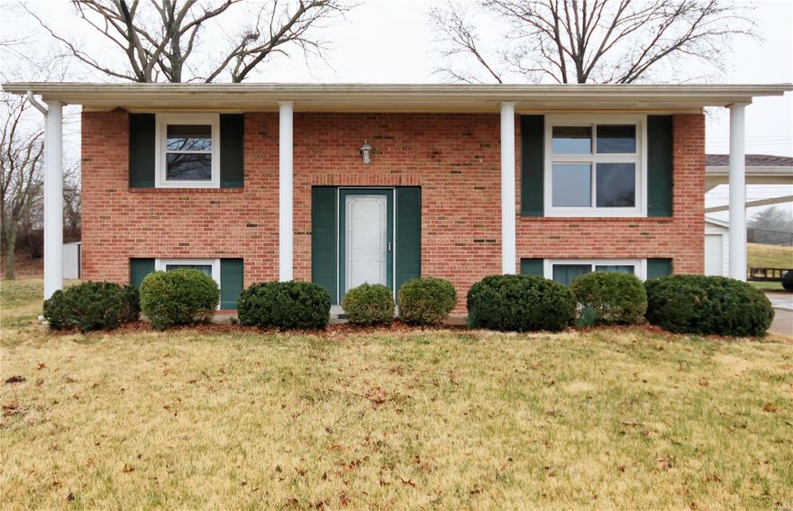 Located in a highly desirable community within walking distance of the community center, walking trails, water and dog parks and local restaurants and businesses, this spacious and well-maintained home with fresh paint, newer carpet, windows and HVAC will not disappoint. An open floor plan featuring hardwood and ceramic tile flooring. The center island kitchen has lots of counter and cabinet space, a dining or family room addition. The deck overlooks the back yard and makes this a busy family or entertainers delight. There are four bedrooms, two full baths, a lower level family room and comfortable laundry and storage area. Outside is a detached oversized two car garage, one car carport and a fenced yard.