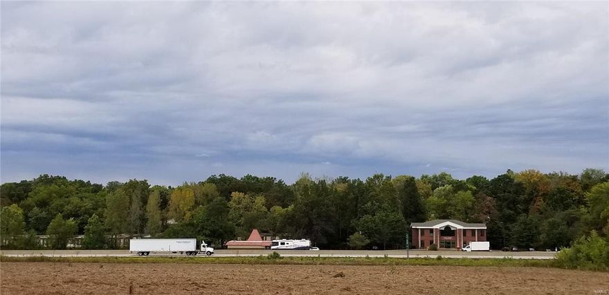 18 Acre Commercial Lot with 1265’ of frontage on Interstate 70 with 90,000+ vehicles per day.   Located on E. Pitman Ave. 1.5 miles west of Lake St. Louis Blvd. interchange of I-70.  Wentzville Sewer and Water available to site.  Zoned C-3 Highway Commercial.  Great Site for Commercial Business or Light Manufacturing.  Additional 1-6 Acres available to add to site. Location: High Traffic, Hwy/Interstate Frntg, Industrial Area