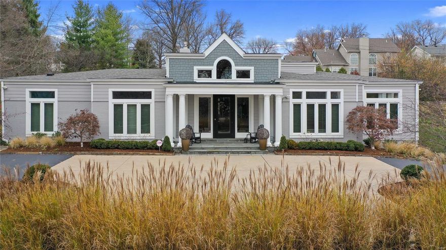 A circular driveway delivers you to the grand entryway of this lavishly presented 4BR home set on an elevated lot in upscale Ladue. Inside, unfolds a sumptuous light-filled interior accentuated by a vaulted ceiling and a mix of full height glass, transom & picture windows. The home’s centerpiece is a delightful great room with fireplace, custom cabinetry & wet bar. Another focal point is the expansive sunroom overlooking the lush, landscaped yard.  A chef’s kitchen will delight any gastronome, and there’s a dining room for entertaining. Of the opulent bedrooms, two have ensuites - primary featuring dual vanity, whirlpool tub & shower. There’s also direct access to a lovely courtyard with elegant stone pathway. The 4500sqft+ floorplan incorporates a tuck-under 2-car garage, family room, 4th bedroom & full bath on the lower level. This prestigious property is nestled in the acclaimed Ladue School District and despite its rural feel, is only minutes from restaurants, shops & all amenities