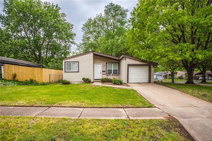 Recently updated three bedroom ranch home with tons of upgrades and features! Vaulted ceilings in family room, kitchen, and bedrooms with tons of natural sunlight! Brand new carpeting just installed throughout! Most of the interior has been freshly painted! Spacious kitchen boasts ceramic tile flooring with lots of countertop space and storage. All appliances including refrigerator are included! Updated bath features ceramic tile flooring and tile surround in tub, updated vanity and brand new medicine cabinet. Low maintenance vinyl siding, newer roof, brick patio and large fenced in back yard located on a premium corner lot! Attached garage! Insulated vinyl windows, 6 panel doors and upgraded baseboards! This home is move in ready and at this price, will not last!