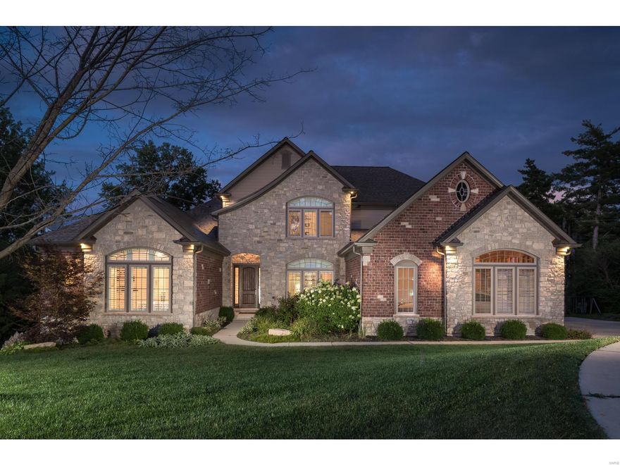 Stunning 1.5 story custom home with over 6,100 sq ft of living space located in the heart of Ladue with finishes for today's most particular buyers. Walk into an oversized tile entry foyer with ample natural light, 10ft ceilings that opens to a spacious living room with hardwood flooring, built-in shelving & a gas FP w/custom stone mantel. Main fl Luxury Master offers his /hers walk-in closet, dual sink vanity, an oversized shower w/floor to ceiling tile & a dual shower head w/ rain shower.  2nd master has a handicap accessible en-suite bath.  Open gourmet kitchen is fitted w/42" custom white cabinets w/crown caps, granite countertops w/plenty of prep space, center island w/breakfast bar, Stainless steel appliances, dual oven w/gas cooktop & range hood. Upstairs boasts 3 spacious bedrooms with large family room.  Finished Walkout LL w/1800sq ft, 10 ft ceilings, large rec area,  game room, 6th bedroom & a full bath. 3 zone geothermal HVAC, tankless water heater & built-in generator!