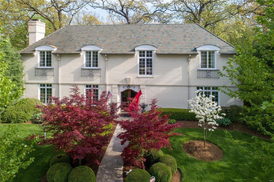 HUGE PRICE REDUCTION!  Gracious 4 bath home is located on a tree lined street in the heart of Ladue.  The formal foyer welcomes you with its curved staircase, gorgeous walnut flooring and curved entries into the formal living rm with antique marble fireplace, formal dining rm and family rm/den overlooking and opening to the back patios and professionally landscaped level backyard.  The butler's pantry with wet bar and the kitchen overlooks the patio perfect for Summer dinners or lounging with friends and family.  The spacious 2nd level offers a master suite with custom dressing area and marble bath.  A large bedrm, 2 bedrm suites, loft/homework area and large laundry room are found on the 2nd floor.  Another room used for storage connected to a bath would make a perfect 5th bedrm.  The possibilities are endless.  This private home sits on just under an acre in a neighborhood with many expanded and renovated homes.  Private yard is perfect for a pool.  So many beautiful details. Additional Rooms: Mud Room