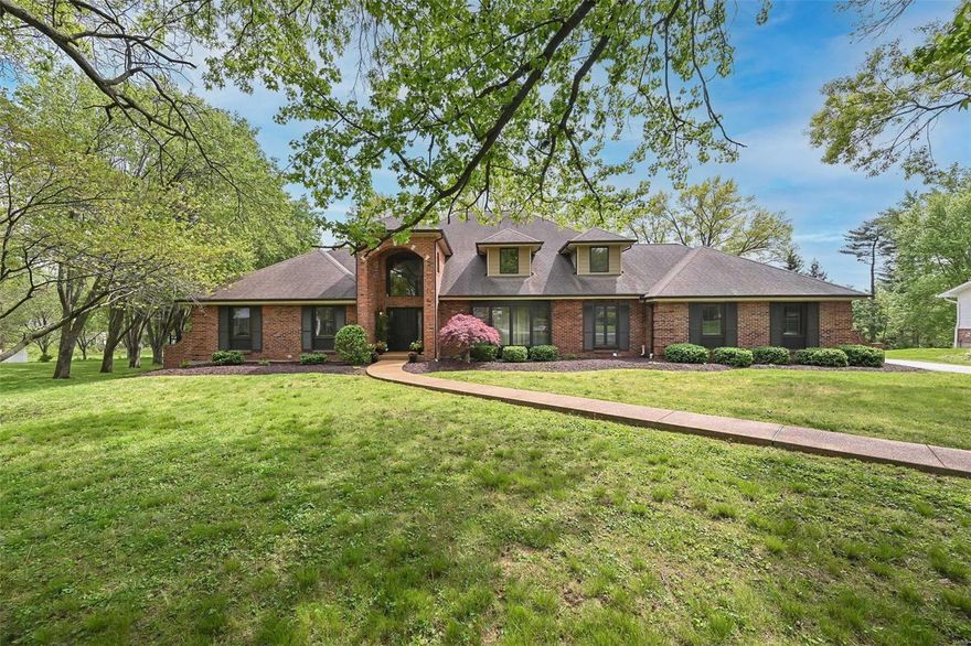 Exceptional full brick 1.5 Sty beautifully updated & expanded to accommodate daily comfort & gracious entertaining. Over 6000 sf of living space enhanced by soaring ceilings, detailed trim work, plantation shutters & Brazilian cherry flooring that extends throughout the main living area. Impressive 2-sty foyer leads to formal DR w/ wide bay window, coffered FR & vaulted GR w/ cast stone fireplace, wet bar & dramatic wall of windows. Designer kitchen w/ white cabinetry, granite countertops, 9’ L-shaped center island & convenient planning center adjoins spacious breakfast room. Primary bedroom suite w/ luxury bath w/ jetted tub plus a 2nd bedroom, 2nd full bath, powder room & laundry room complete the main floor living quarters. Hardwood staircase accesses 3 additional bedrooms, 1 w/ ensuite bath, 2 full baths, loft sitting area & 2nd laundry. Walk out LL includes a recreation room, office, 2nd kitchen & full bath. Situated on a .89-acre cul-de-sac lot w/ expansive patio & pool.