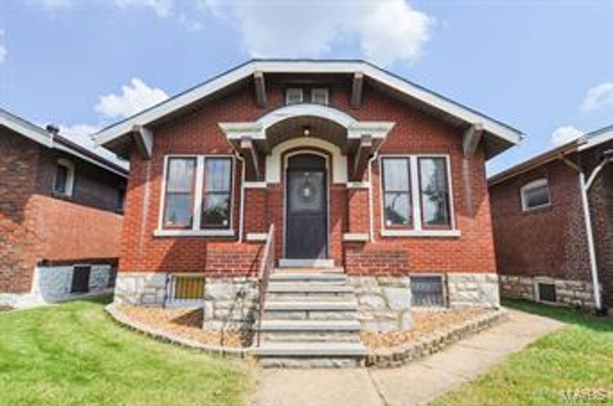 Est. 1924: Beautiful 2 Bed/1.5 Bath Brick Bungalow in the sought-after Holly Hills. Step inside from the covered front porch to find gleaming hardwood floors & original stained glass windows in the inviting Living Room. Walk past the Beautiful Wall Sconces and into the Dining Room before Discovering the Sizable Eat-in Kitchen w/ Plenty of Counter Space. Side Hallway leads to Full Bath (tub recently reglazed), Front Bedroom w/ Hardwood Flooring, and Spacious Rear Master w/ Newer Carpet (Hardwoods underneath), Walk-in Closet w/ Custom Organizer, & Skylight. Head downstairs to find a Finished Music Room, 1/2 Bath, Walk-out, & Plenty of Great Storage Space. The Backyard welcomes you with Rear Deck off Kitchen, Concrete Patio (perfect for BBQ’s), & 2-car Oversized Garage.