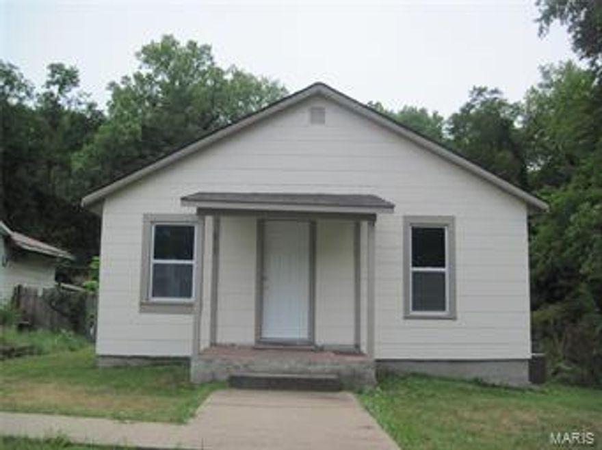 Neat and petite and ready for you!  This cozy little house has had a complete interior renovation, and is perfect for starting out or slowing down in life!  The interior walls were gutted and re-designed, and the home has all new drywall, insulation, wiring, plumbing, paint, furnace, central air, duct work, water heater, windows, doors, bathroom, kitchen, flooring and lighting.  The exterior has a fresh coat of paint and a welcoming front porch.  Nestled in a private setting at the end of the street, the level lot has a one car detached garage.  This pretty little property is priced to move!