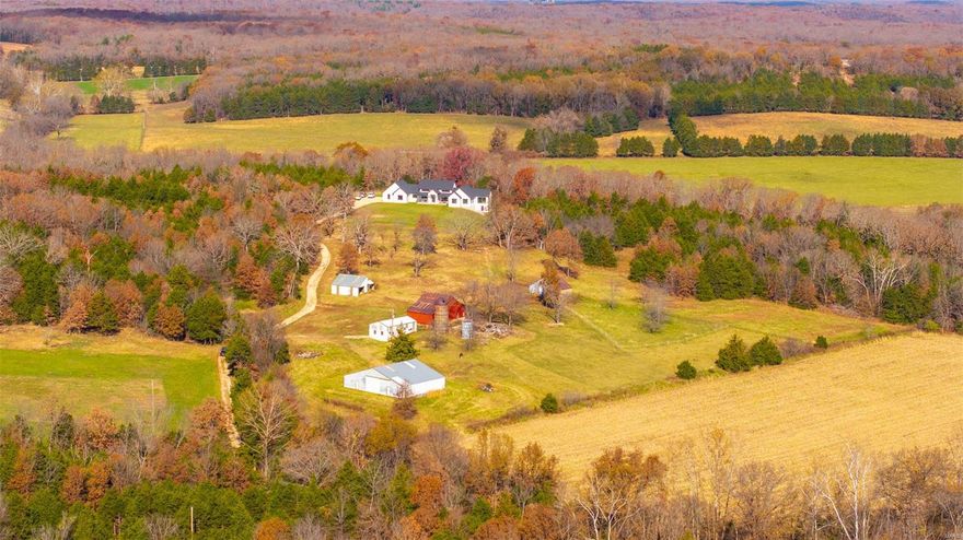 TURN KEY…JUST IN TIME FOR THE HOLIDAYS!!!Embrace yourself for country living at its finest with this modern farmhouse of your Dreams! This stunning home is situated on 51.23 picturesque acres in Rosebud, Mo. From the soaring vaulted ceilings to the impeccable, engineered white Oak hardwood floors, you’ll find no attention to detail was spared and no corner was cut in the fine craftsmanship. Sprawling open floor plan with abundance of natural light throughout the home. Lavish custom kitchen cabinetry, butler’s pantry, quality appliances, are sure to adorn culinary enthusiasts & entertainers alike. Full walkout lower level has been framed, wired and ready for dry wall for additional living space. Primary suite offers a stylish finish & serene atmosphere to retreat to.  If your passion is sunsets and wildlife, there are multiple outdoor spaces to take in the serene views. The barn and out buildings offer an ample amount of storage and space for your livestock & machinery.Welcome Home!!! Additional Rooms: Mud Room
