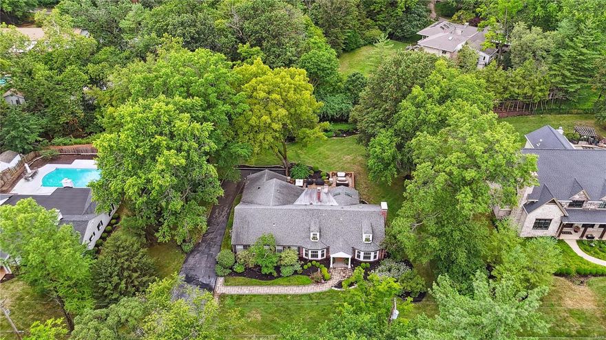 This charming 1.5-story house is situated on a spacious lot of over half an acre, surrounded by lush greenery that provides a serene and private retreat. The living and dining rooms feature newer bay windows that offer stunning views of the beautifully manicured front yard. The main floor of the house boasts 3 bedrooms, while the 2nd floor features 2 additional bedrooms w built in bunks and a spacious attic that provides ample storage space. There are 4 updated full baths! The updated kitchen is perfect for entertaining guests and overlooks a large new patio that is ideal for outdoor gatherings. The updated kitchen features a wall of windows that frames views of the secluded yard. The family room is complete with built-in bookcases and offers additional dining space. This house is conveniently located near downtown Clayton, providing easy access to all the amenities the area has to offer. It is a perfect balance of comfort and privacy, this house is an ideal place to call home.