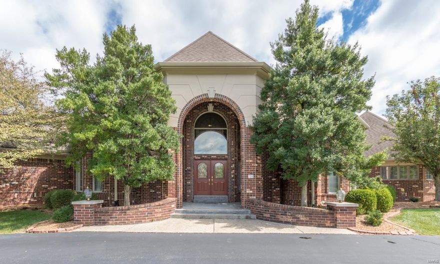 Welcome to 706 The Hamptons Lane. This beautifully landscaped, brick/stone, 4 bed, 7 bath  home with 3 car garage sits perfectly on a 1+ acre level lot with access to Hwy 40/270 and 141. Upon entry you will be greeted with stunning mill work and drawn into the incredible views in your spacious family room with 14' arched floor to ceiling windows. Master bedroom suite with sitting room, two walk in closets, and luxury bath with jetted tub, double vanities and seamless walk in shower perfect for rest and relaxation. Fabulous custom wood grace the  study. Unique dining room perfect for formal dinners. Fantastic hearth room, wet bar and light and bright kitchen with center island, double oven, large pantry, main floor laundry and your stunning outdoor space, heated in ground pool, gazebo, and waterfalls just steps away. Dual staircases take you to 3 en-suite bedrooms each with walk in closets and full baths.  Lower level has media, exercise, rec room with wet bar with tons of storage.