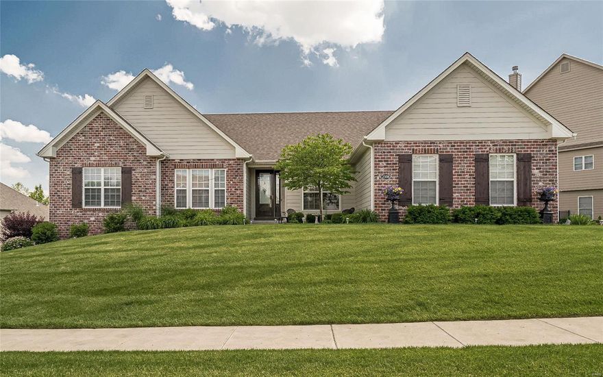 Just 5 years new - none of the hassle & cost of new construction, a wonderful gated community!  Beautiful landscaping leads to an 8' leaded glass front door that reveals an open floor plan! Hardwood flooring through common living area & hall. Kitchen opens to hearth room, breakfast rm & great rm ww/ 12" ceiling.  Light spills in through a wall of windows.  The kitchen has a huge island, walk in pantry, double oven, 5 burner gas cooktop with hood, granite counters, stainless steel appliances, tile backsplash, 42" custom cabinets with soft close drawers & pull out shelving. Hearth rm has gas FPL, beautiful stone hearth, 2 walls of windows.. Breakfast rm overlooks the composite deck. Master suite large frameless shower w/ bench, soaking tub & ample walk in closet. Built by Fischer and Frichtel, iron stair spindles, 5 3/4" base molding, adult height vanities & more!  Architechtural shingles, HardieBoard siding, 3 car side entry garage, sprinkler system. 3 minutes to 364 - great access!