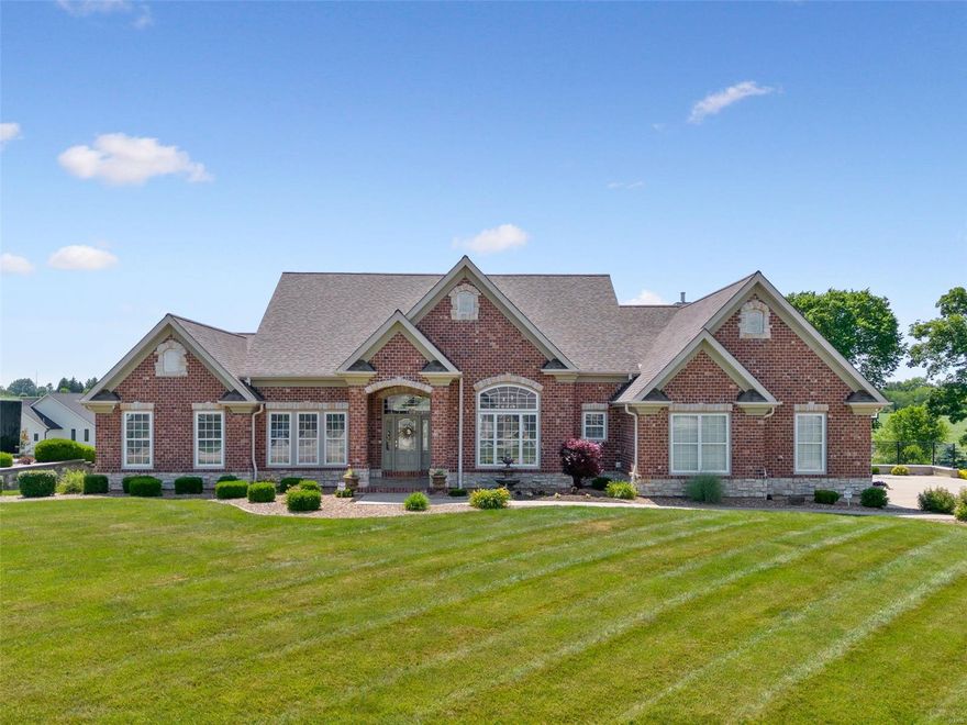 Stunning atrium ranch in the sought after Westborough Estates subdivision. This 5 bed/4 bath home is magnificent, boasting beautiful updates throughout 5,400 sqft of livable space. You'll love the curb appeal showcasing a classy brick and stone exterior, 3 car garage, large deck, security camera system, and lavish salt water pool complete with pool house, kitchen, half bath, stone fire pit, waterfall feature and brick fireplace - perfect for entertaining! Inside offers an impressive open concept layout, hardwood floors, high ceilings, elaborate crown molding, fireplace, updated baths, main floor laundry, sonos surround sound system, and grand windows. The kitchen is furnished with quartz countertops and SS appliances. The main level offers 4 bedrooms including a glamorous primary bedroom suite with a large walk-in closet, spa-like bathroom with a soaking tub, separate shower and dual vanity. The lower level sparkles with its large family room, game area, wet bar, and bonus bedroom.
