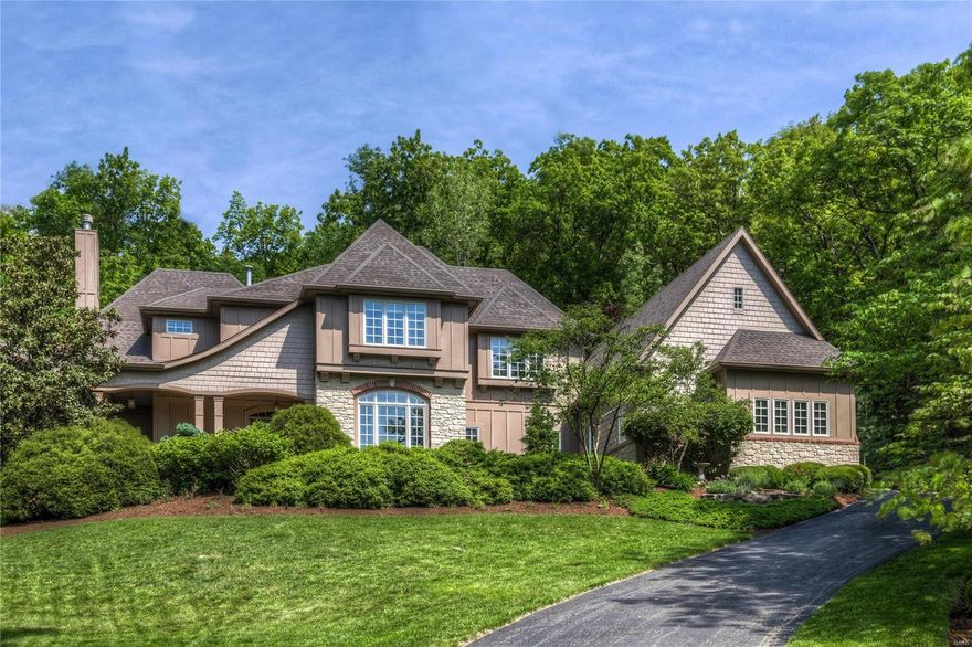 This custom built English Country home is sitting on 3 private acres! You will love the attention to detail, beautiful millwork and 10 ft. plus ceilings, 4 fireplaces, and a screen porch across the back of the home. Fabulous open kitchen, breakfast rm and hearth rm. Custom cabinets, granite, SS Viking gas range, sub-zero refrigerator and center island. Wet bar and stone fireplace with double doors leading out to the  screen porch in hearth room. Living rm with box beamed ceiling, built-in bookcases and a fireplace. Main floor master with luxury bath. 3 bedrooms each with a walk-in closet and private bath on upper level. A great service area with laundry rm, cubby and an office area . Additional living are can be found in the walkout LL with bar, fireplace,and rec rm with pool table area. There are several patio areas, 1 with built-in barbecue grill! Sprinkler system, security system and central vac. This home affords privacy but still close to Babler park, Wildwood Town Center and 40!