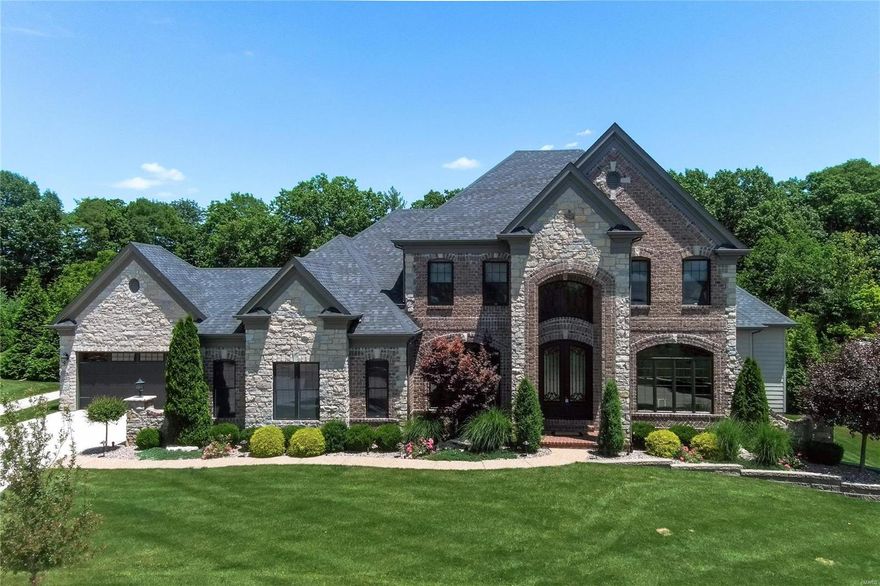 Meticulously maintained 6 bed, 4 1/2 bath, 4 car garage, 1.5 Sty in prestigious Arbors At Wilmas Farm.  Extensively upgraded custom finishes throughout home. Chef's kitchen w/custom cabinets (glass uppers, lighting), Cambria tops, 48" Wolf cooking, Sub-Zero refrigeration, oversized island, walk-in custom finished pantry, wine fridge & designer lighting! Master suite boast French doors to outdoor living, luxury bath w/jet tub, oversized shower, dual vanities, & his/hers outstanding separate walk-in custom closets. 10' main / LL ceilings, atrium windows, formal dining, upgraded mill / trim work, 8' doors, crown, wainscoting, built-ins. Finished LL has full bath, wet bar, media room, 6th bedrm & walk in wine cellar. Professional landscape, Resort inspired exterior with expansive custom covered outdoor living, cooking, fireplace & fire features, Pebble Tec pool w/ hot tub! Style exudes in and out w/ custom designer finishes & it shows. Great for family life & entertaining. See Virtual Tour Additional Rooms: Wine Cellar