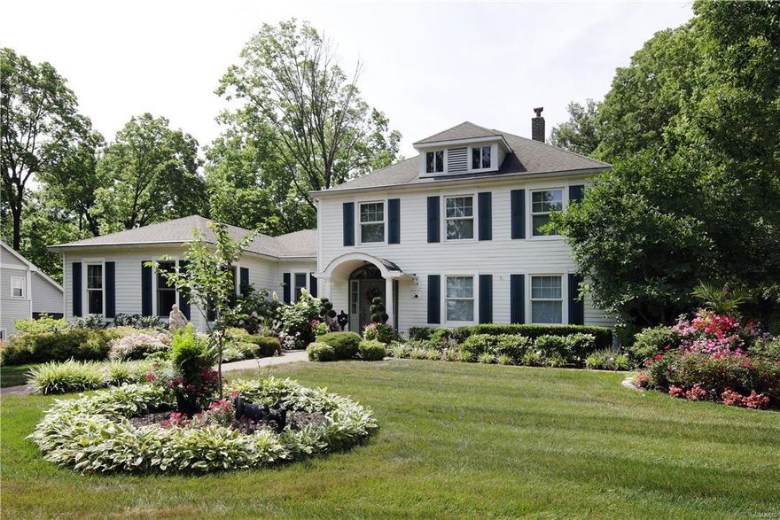 New Price!Stunning renovation and expansion of this century home! The attention to detail & quality of construction are evident. This home features old world charm like 8" baseboards, hardwood floors, & custom millwork. Major energy efficiency efforts like solar panels that provide approx 1/3 of the electrical power and new insulation in the attic. Main floor master suite with his and her sink areas, a soaking tub & walk-in shower.The master closet (10x16) is a hidden gem complete with custom organizers and a pocket door to the laundry room. The gourmet eat-in kitchen/hearth room s truly the heart of the home with custom cabinetry, soaring wood clad ceiling, & a stone gas fireplace. Two sets of French doors lead you to the gorgeous garden featuring a Koi pond with waterfall & separate eating area with firepit. Upstairs there are 3 additional bedrooms, 2 full baths & a charming office with built-ins. The lower level includes a media room & an expansive recreation room with egress window