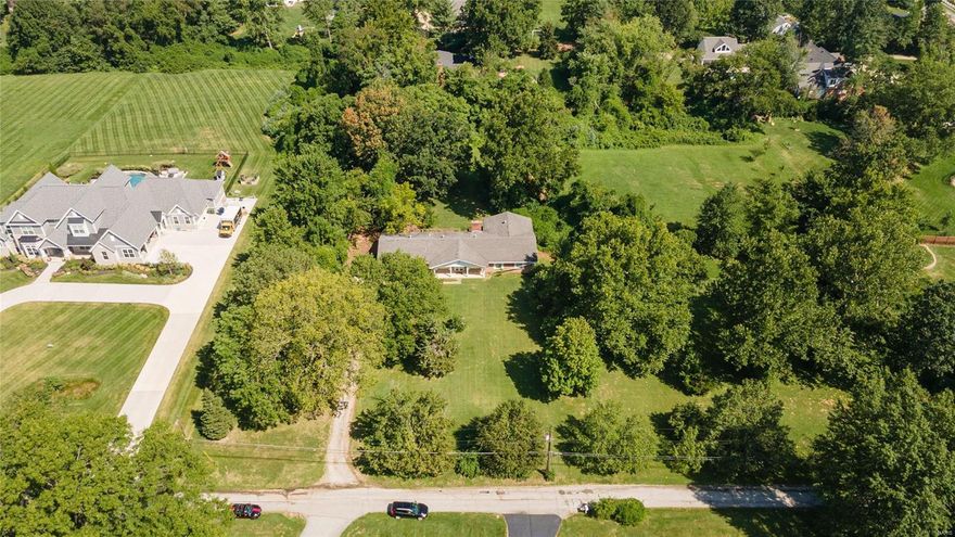 Fabulous opportunity awaits with this hidden gem located on a secluded private lane in Des Peres! 3+ acres of gorgeousness! Ideal for those looking to build their custom dream home or for the savvy investor/developer. The possibilities are endless! 
No sign. House on property is a tear down and will be sold as-is. Please do not walk property without making an appointment.