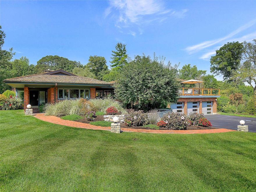 A true show stopper, this impeccably maintained and beautifully renovated contemporary home on a private Ladue lane lends itself to both modern and traditional tastes. A stunning open floorplan welcomes you and immediately you are taken away by the impressive windows, incredible finishes and treasured design. The remarkable kitchen with adjacent mudroom with cubbies is open to the striking dining room and entry gallery. Off the gallery is the expansive living room and den. Up a few stairs you'll find a bonus area which could be an office or homework space with sliding doors that lead to a 700+ square ft deck. On this level you will also find 4 bedrooms and 4 baths; the master featuring his and hers full baths. All rooms equipped with electric blinds, impressive baths and walk-in closets. The ground floor offers a family room, exercise room, an en suite bedroom, and an addl bedroom. A large laundry, 3 car garage and extraordinary landscaping round out this spectacular property. Additional Rooms: Mud Room